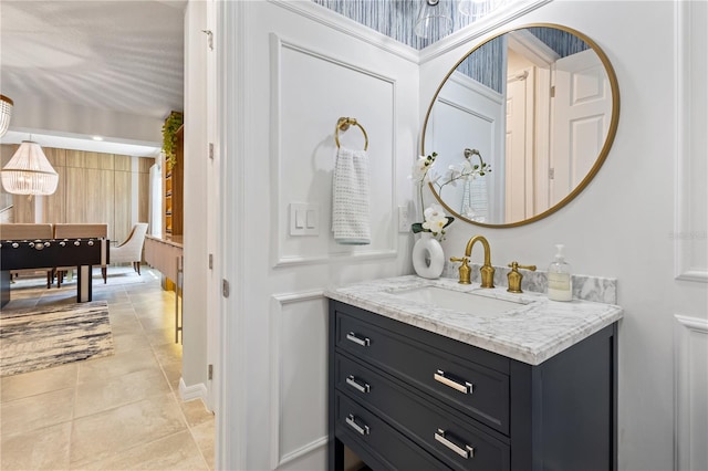 bathroom with tile patterned floors and vanity