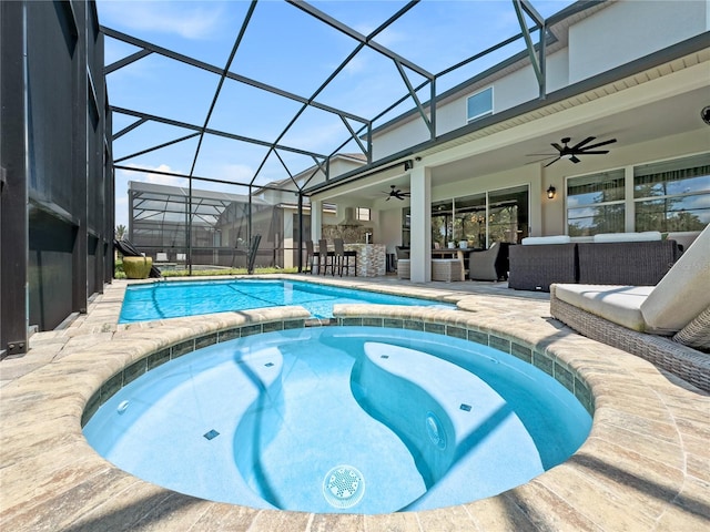 view of pool featuring ceiling fan, glass enclosure, an in ground hot tub, and outdoor lounge area