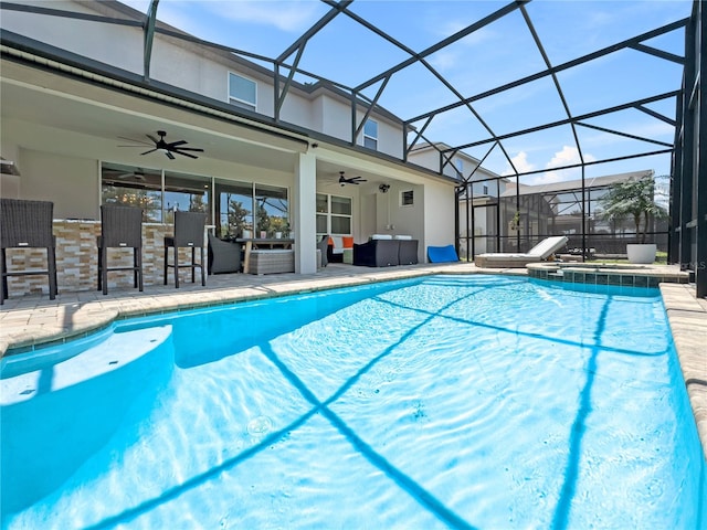 view of pool with ceiling fan, an in ground hot tub, outdoor lounge area, and a lanai