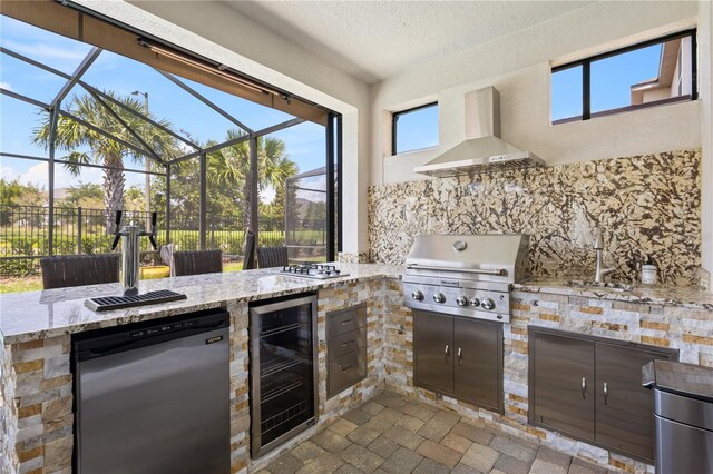 view of patio / terrace with exterior kitchen, sink, a lanai, wine cooler, and area for grilling