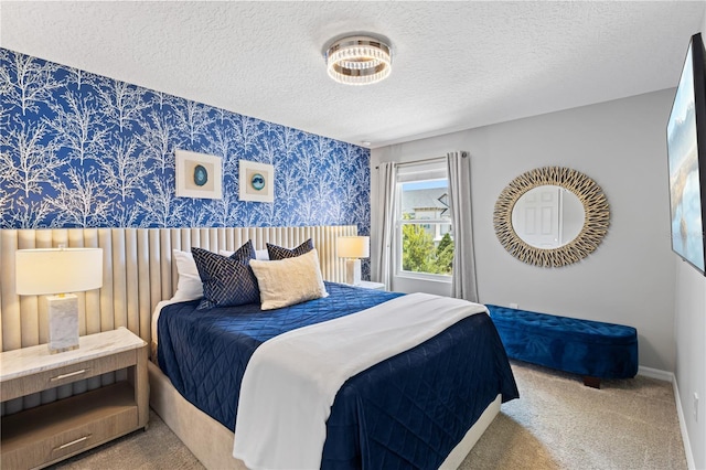 bedroom featuring carpet floors and a textured ceiling