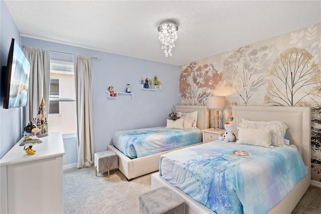 carpeted bedroom with an inviting chandelier