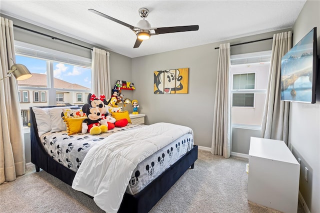 carpeted bedroom with ceiling fan