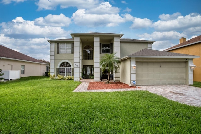 view of front of property with a garage and a front yard