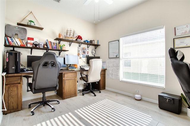 office featuring light wood-type flooring and ceiling fan