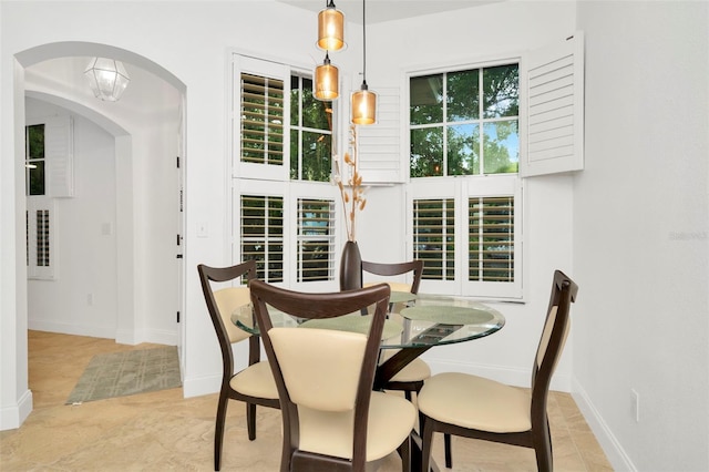 dining area with light tile patterned floors