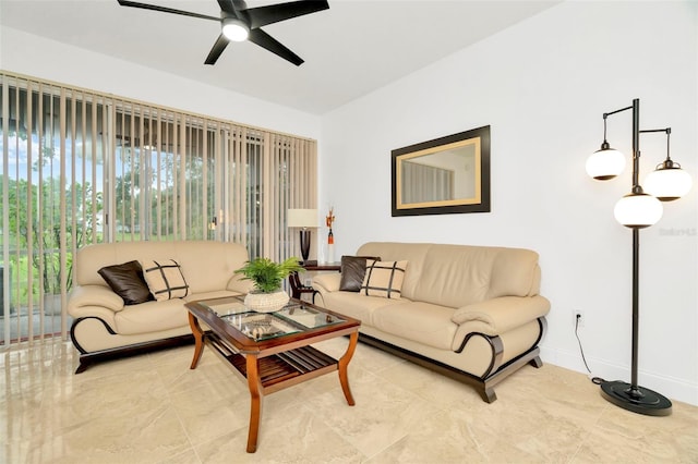 living room featuring ceiling fan and light tile patterned floors