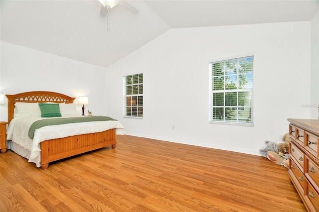 bedroom featuring ceiling fan, vaulted ceiling, and light hardwood / wood-style floors