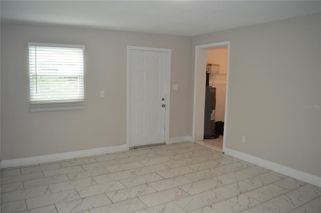 spare room featuring water heater