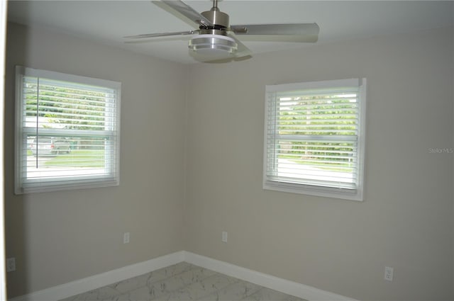 empty room featuring ceiling fan