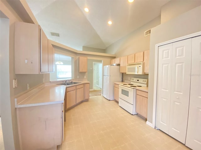 kitchen with white appliances, light tile patterned floors, vaulted ceiling, sink, and light brown cabinets