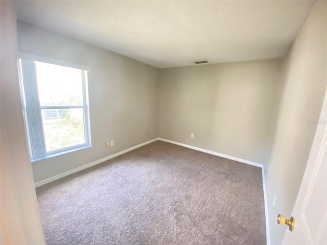 empty room with carpet flooring