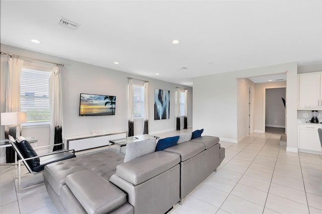 living room with light tile patterned flooring