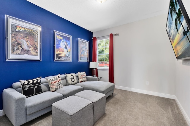 carpeted living room with baseboards