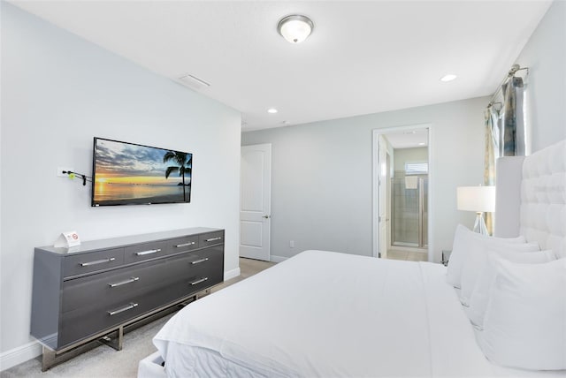 bedroom featuring recessed lighting, light colored carpet, connected bathroom, and baseboards