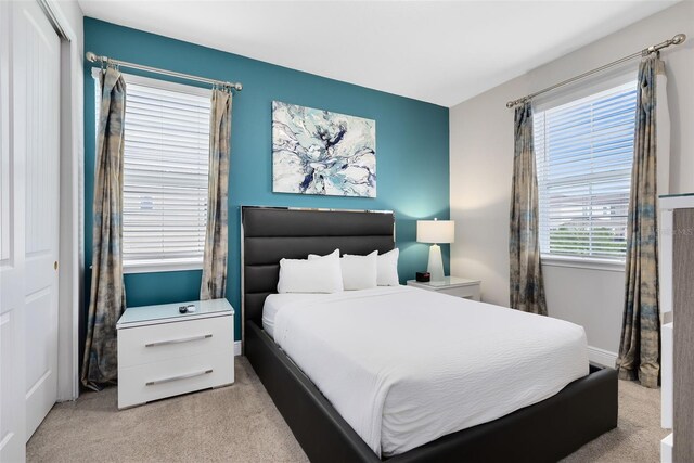 carpeted bedroom featuring a closet