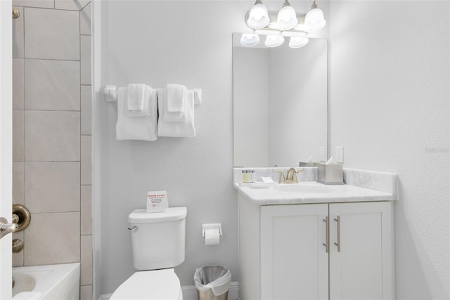 bathroom featuring  shower combination, vanity, and toilet