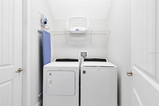 clothes washing area with laundry area and washer and dryer