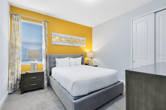 carpeted bedroom with a closet