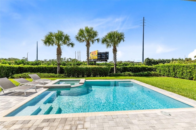 view of swimming pool featuring an in ground hot tub