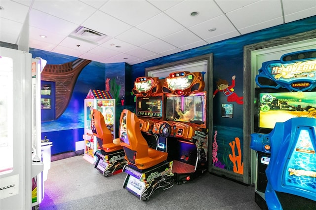 recreation room with a drop ceiling