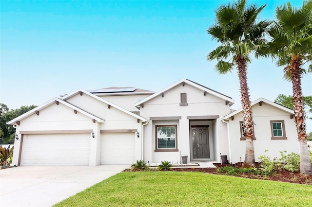 view of front of house featuring a garage and a front yard