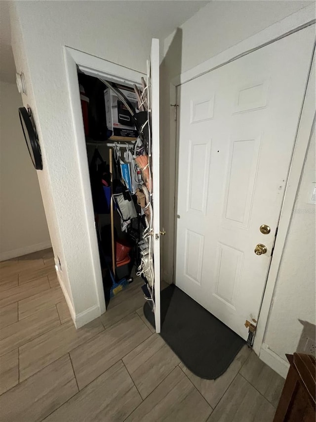 interior space with wood tiled floor and baseboards