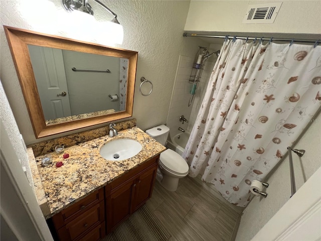 full bath featuring visible vents, a textured wall, shower / bathtub combination with curtain, toilet, and vanity