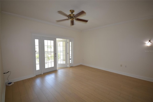 unfurnished room with light hardwood / wood-style floors, ornamental molding, and ceiling fan