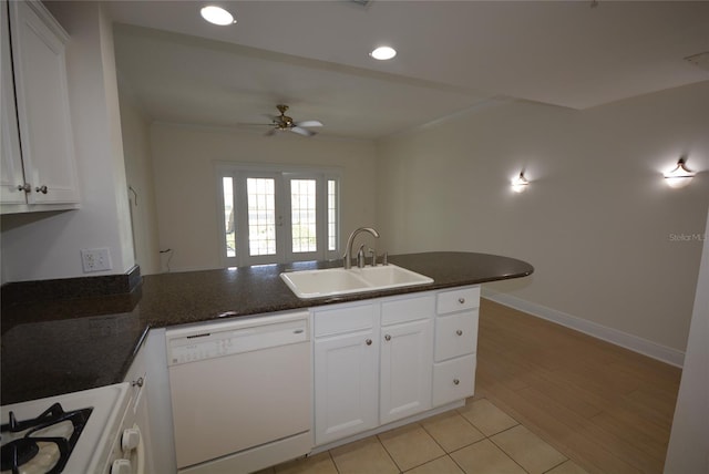 kitchen with sink, light hardwood / wood-style flooring, dishwasher, ceiling fan, and kitchen peninsula