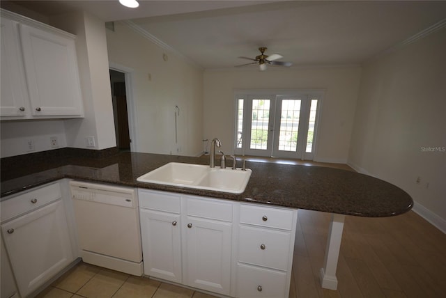 kitchen featuring sink, kitchen peninsula, white dishwasher, and crown molding