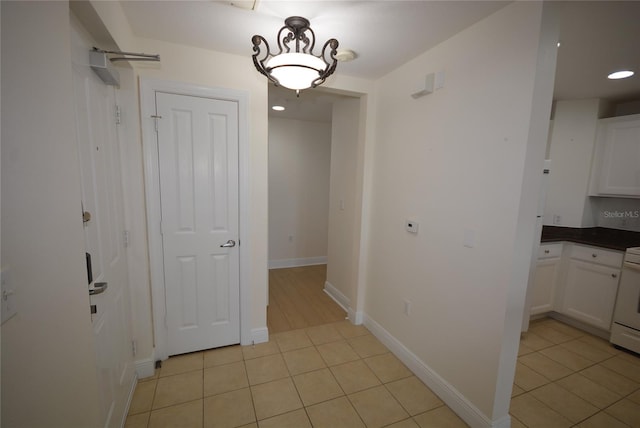 corridor featuring light tile patterned flooring