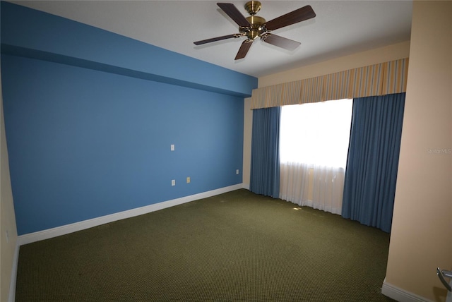 spare room featuring ceiling fan and carpet flooring