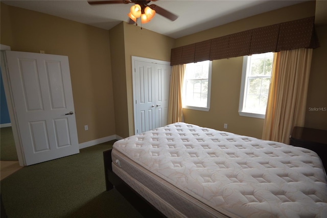 carpeted bedroom featuring ceiling fan and a closet