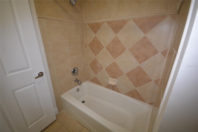 bathroom with tile patterned floors and tiled shower / bath combo