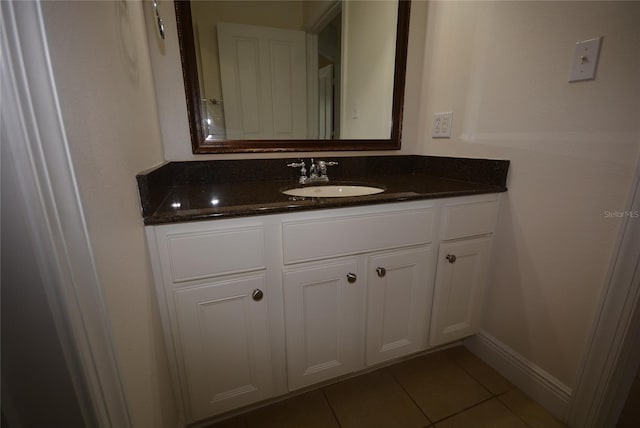 bathroom featuring tile patterned flooring and vanity