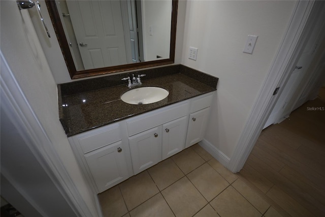 bathroom featuring tile patterned floors and vanity