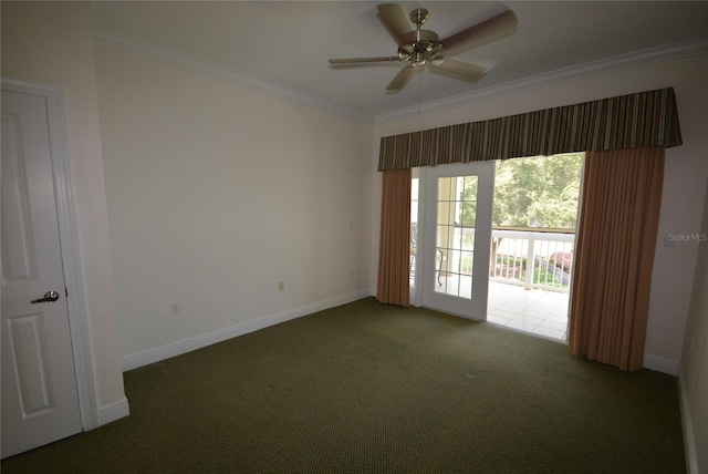 carpeted spare room featuring ceiling fan and crown molding