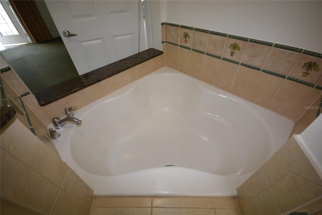 bathroom featuring tiled bath