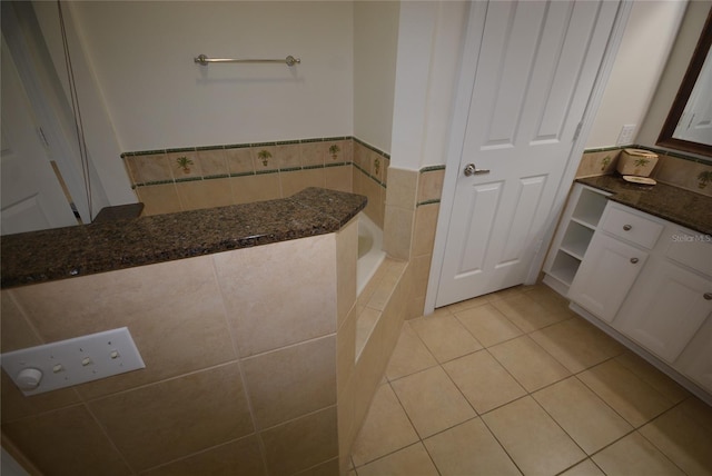 bathroom with tile patterned flooring and vanity