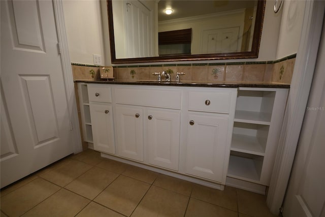 bathroom featuring decorative backsplash, ornamental molding, vanity, and tile patterned floors