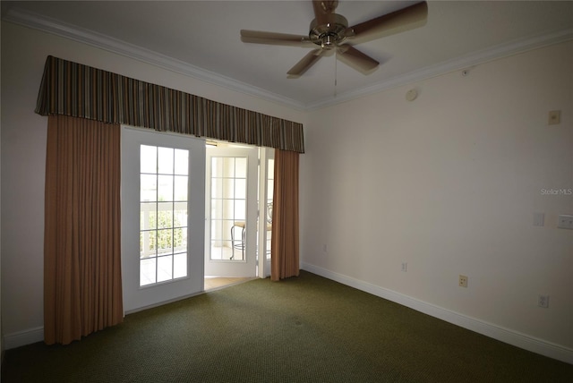 carpeted empty room featuring ceiling fan and crown molding