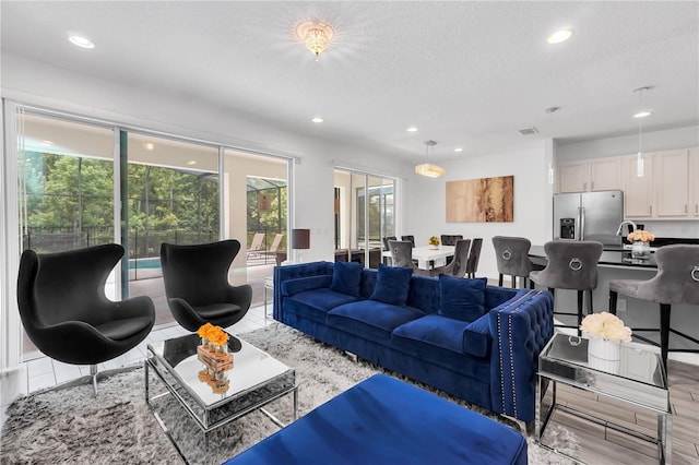 living room with a textured ceiling