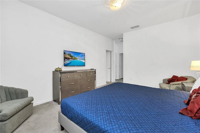 bedroom featuring light carpet