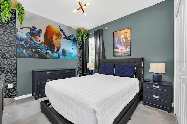 carpeted bedroom featuring a chandelier