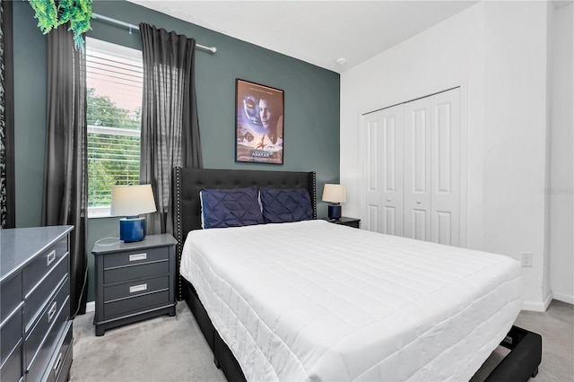 carpeted bedroom featuring a closet