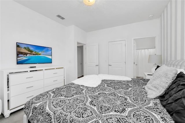 bedroom featuring light colored carpet