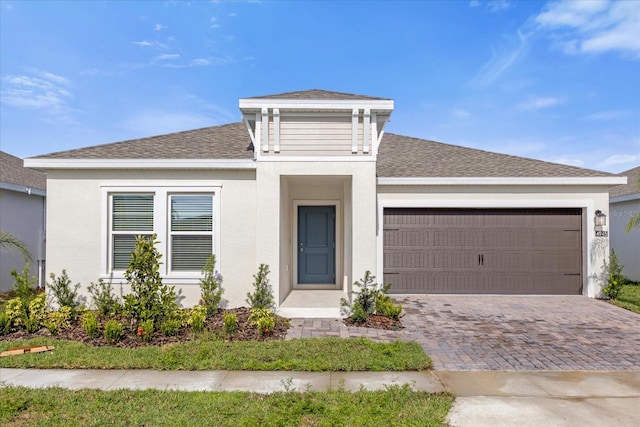 view of front of home with a garage