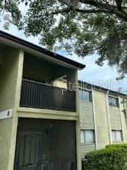 view of side of property featuring a balcony