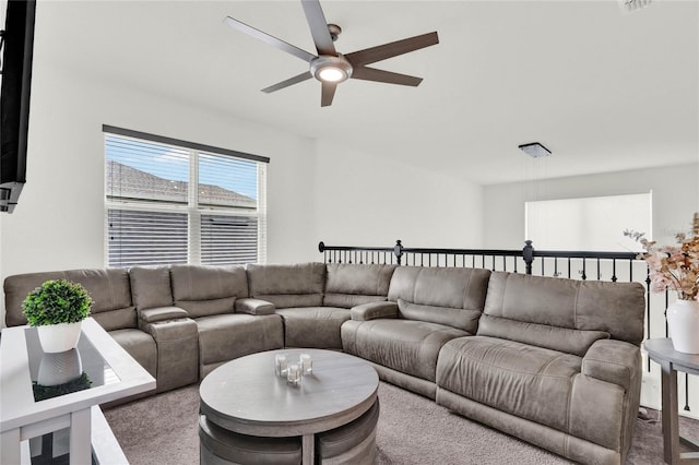 living room with ceiling fan and carpet floors